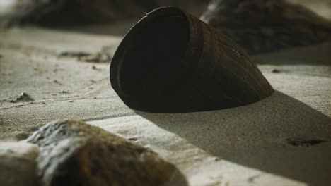 old wooden barrel on the beach