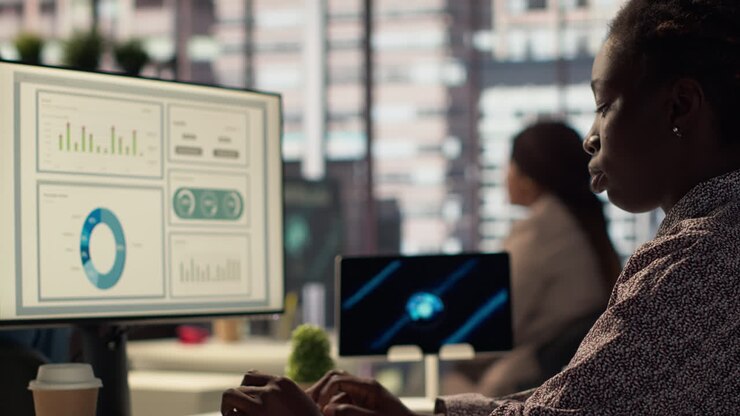 African American Woman Working on Data Analysis