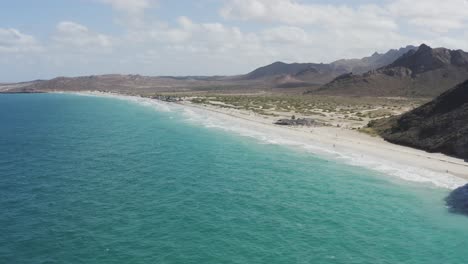 drone flies over the coast of tecolote beach, baja mexico