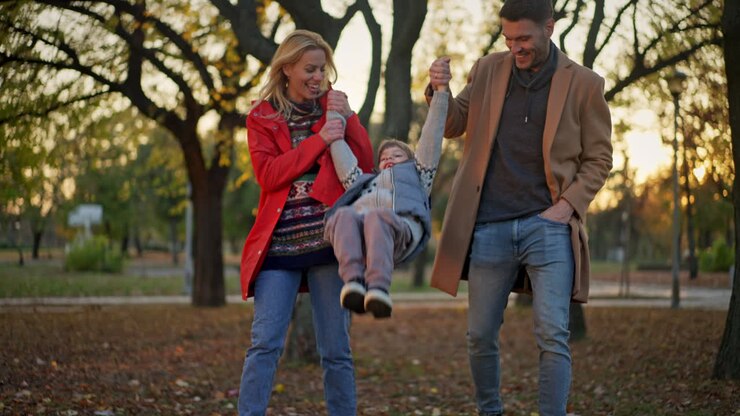 Family enjoying a fall day in the park