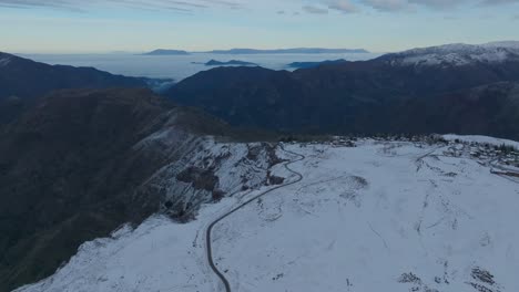 Aerial-establishing-shot-of-the-Andean-Mountain-Range-with-snow-during-winter