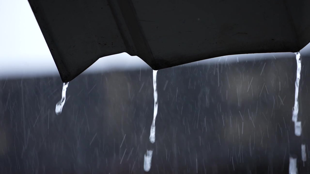 It is raining in urban areas or city life.
