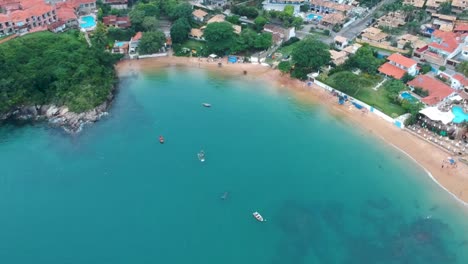 drone view of high altitude boats in the water lagoon in brazil, rio de janeiro beach shore