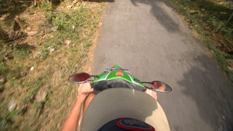 pov riding a moped through the jungle