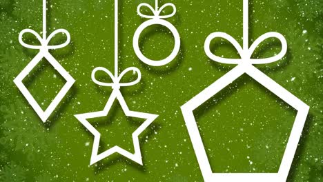 Animation-of-snowflakes-falling-over-white-christmas-baubles-outline-on-green-background