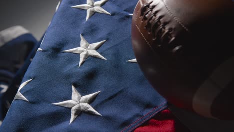 close up studio shot of american football on stars and stripes flag 4