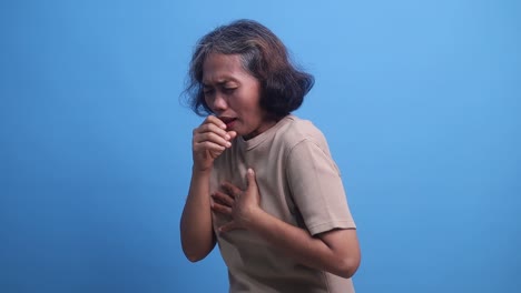 elderly woman coughing and experiencing chest pain