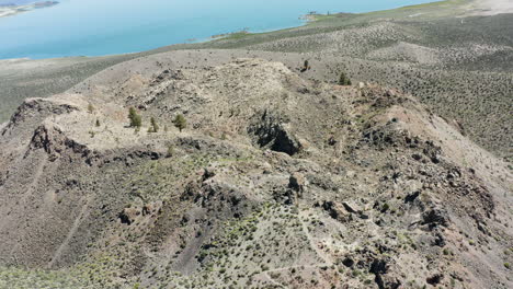panoramic view of arid rocky hills overlooking a large lake