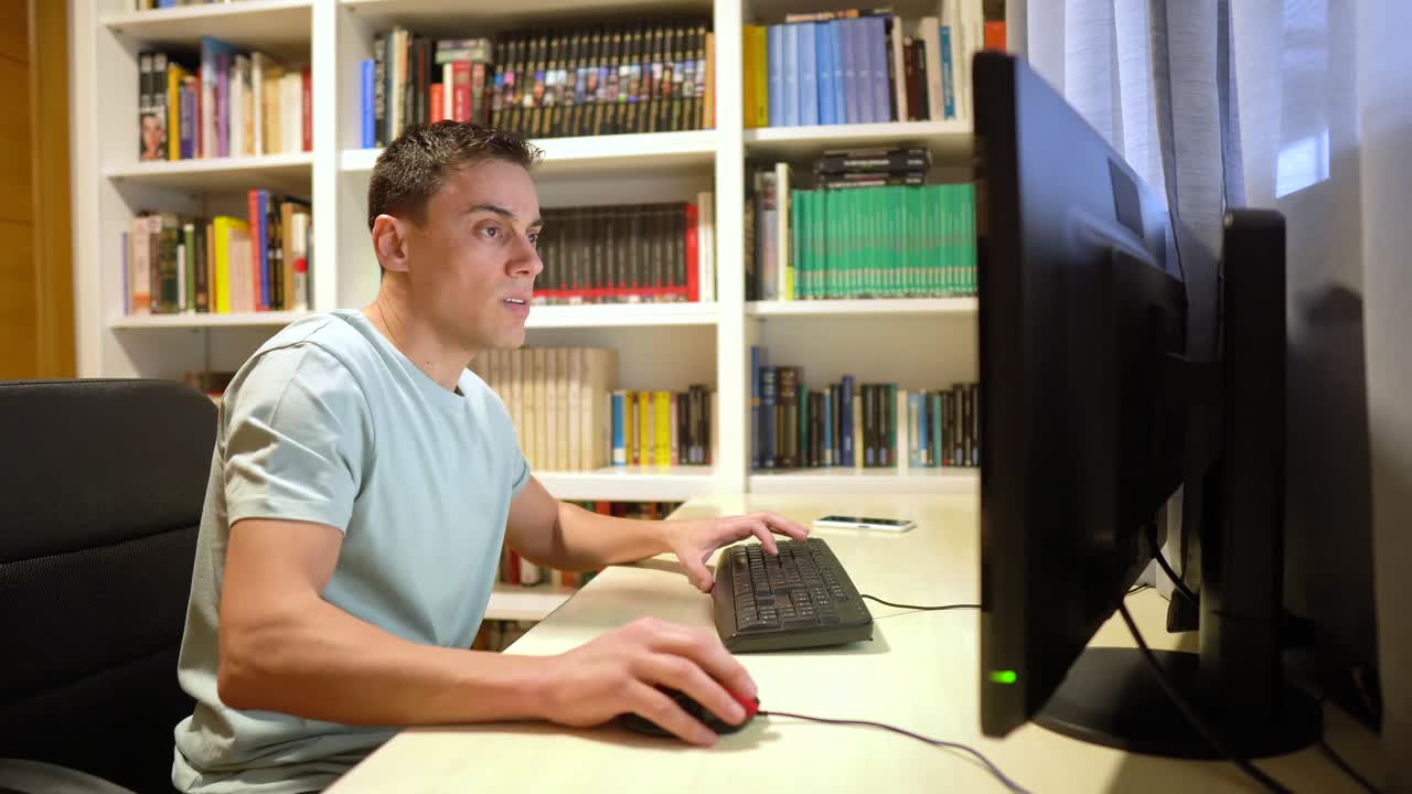 Man experiencing growing frustration while working on a computer