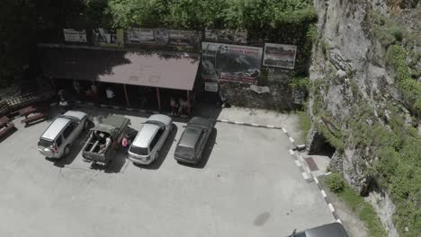 approaching drone shot towards the devil's throat entrance in trigrad gorge, situated in rhodope mountains in bulgaria