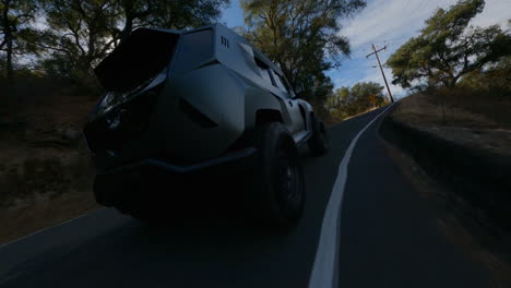 cinematic fpv shot on the back bumper of a new suv police car