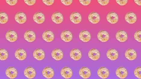 abstract colorful animation - donuts with colorful sugar sprinkles move up circling diagonally on pink gradient background - seamless loop.