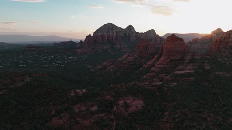 lush vegetation covering red rock deserts near sedona suburbs in arizona during sunset