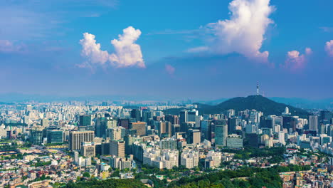 seoul city skyline time lapse of moving clounds at sunset, business downtown distict with many skyscrapers and office buildings around namsan tower, south korea - static
