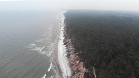 Aerial-shot-of-sandy-beach-in-Ustka-in-winter