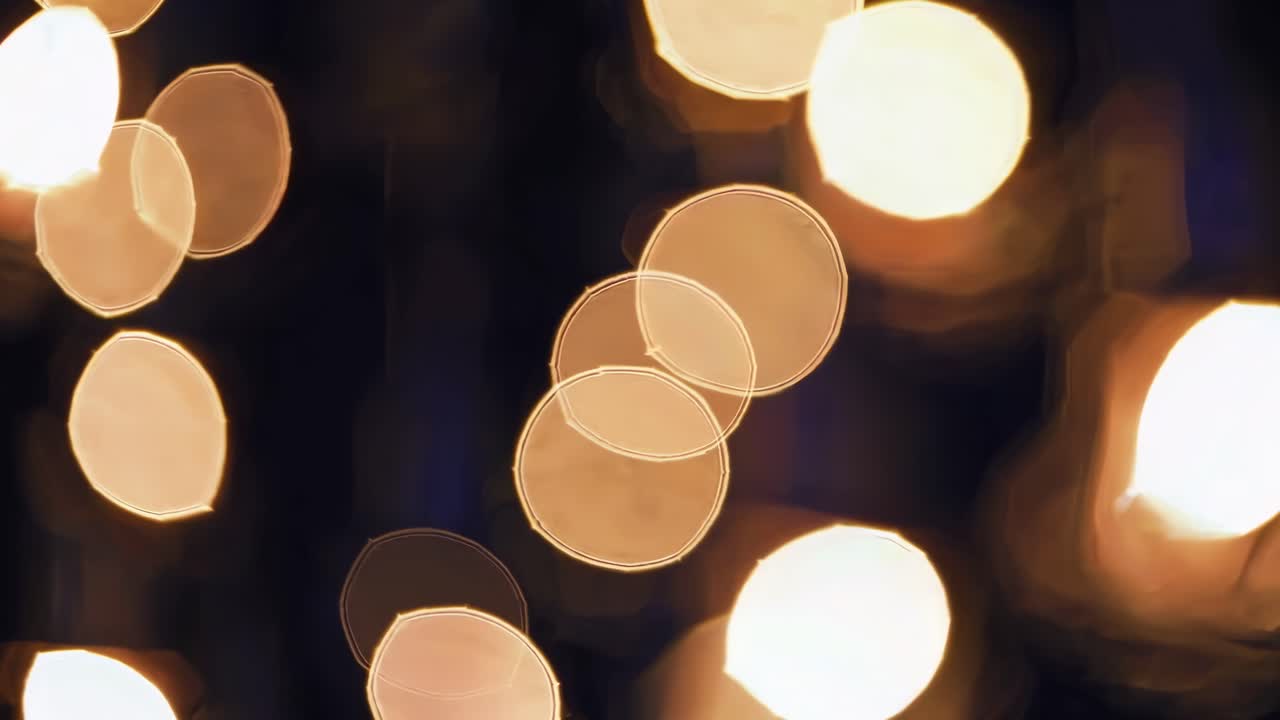 Radiating beautiful golden bokeh lights, creating a magical and festive atmosphere against a dark background, enhancing holiday and celebration themes with elegance and warmth