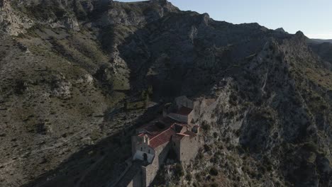 Aerial-view-of-Hermitage-Notre-Dame-de-Pene-built-on-rocky-ridge-top