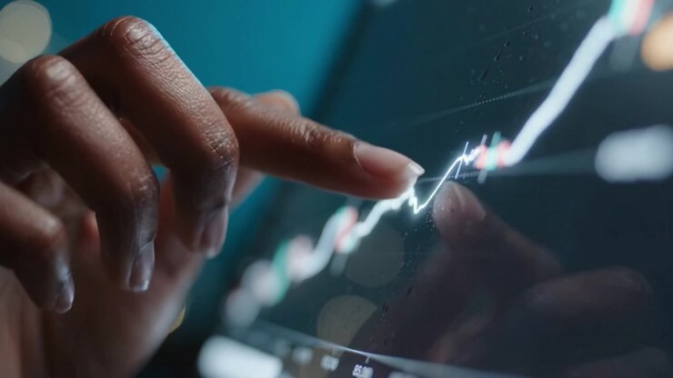 Analisi delle tendenze finanziarie: una vista ravvicinata dell'analisi del mercato azionario tramite interfaccia touchscreen che mostra dati grafici dettagliati che tracciano i modelli di crescita