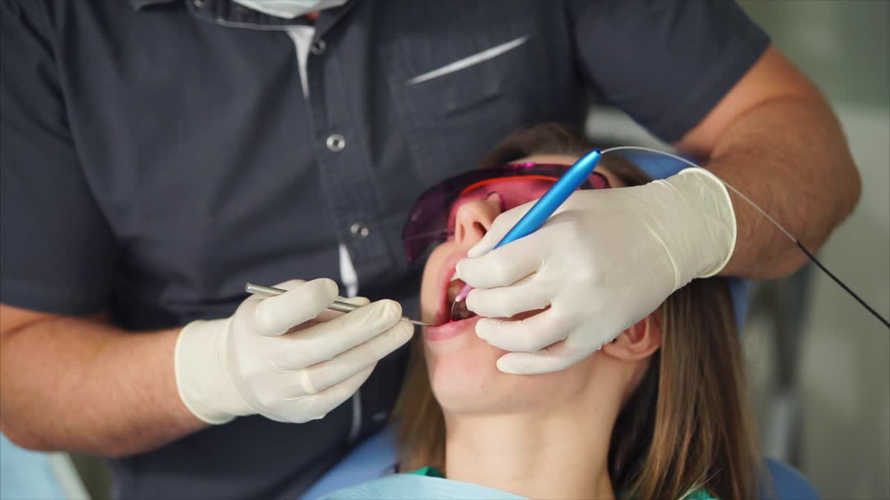 Dentist Performing a Dental Procedure