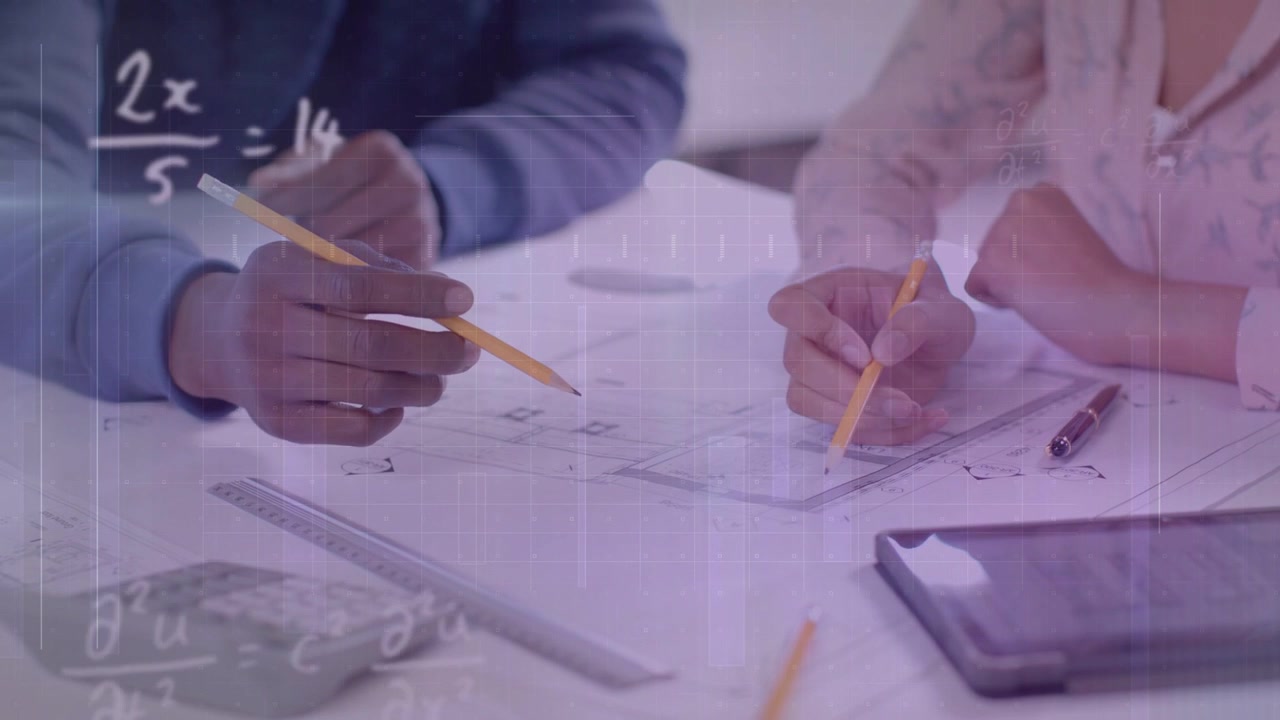 Two designers one pointing and nudging other tracing plan with pencil math overlay marking layout