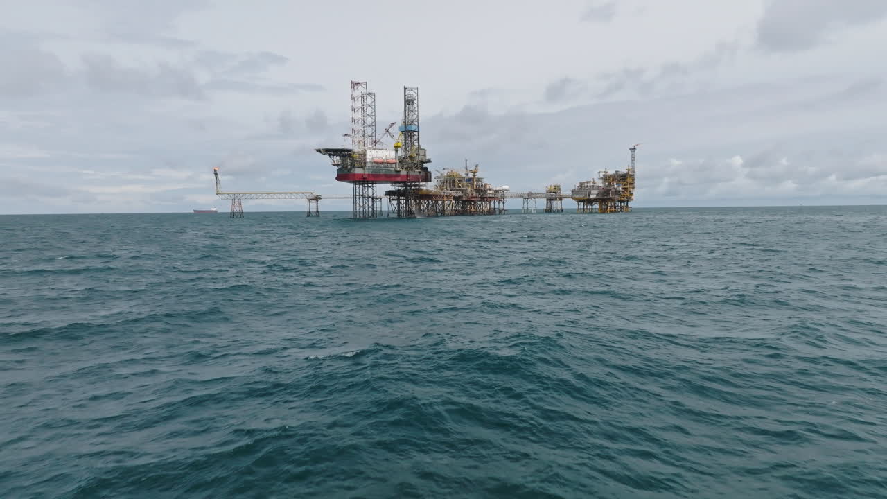Establishing shot of offshore processing platform, oil and gas industry
