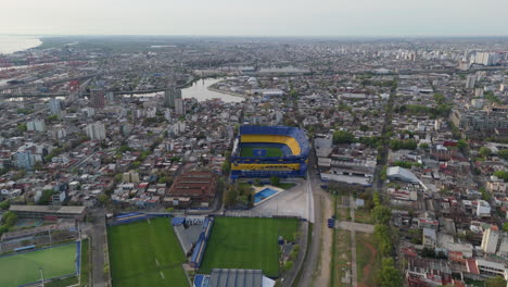 aerial view of iconic la bombonera stadium, home of boca juniors, nestled within dense urban of buenos aires.