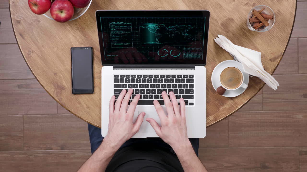 Person working on a laptop at a table