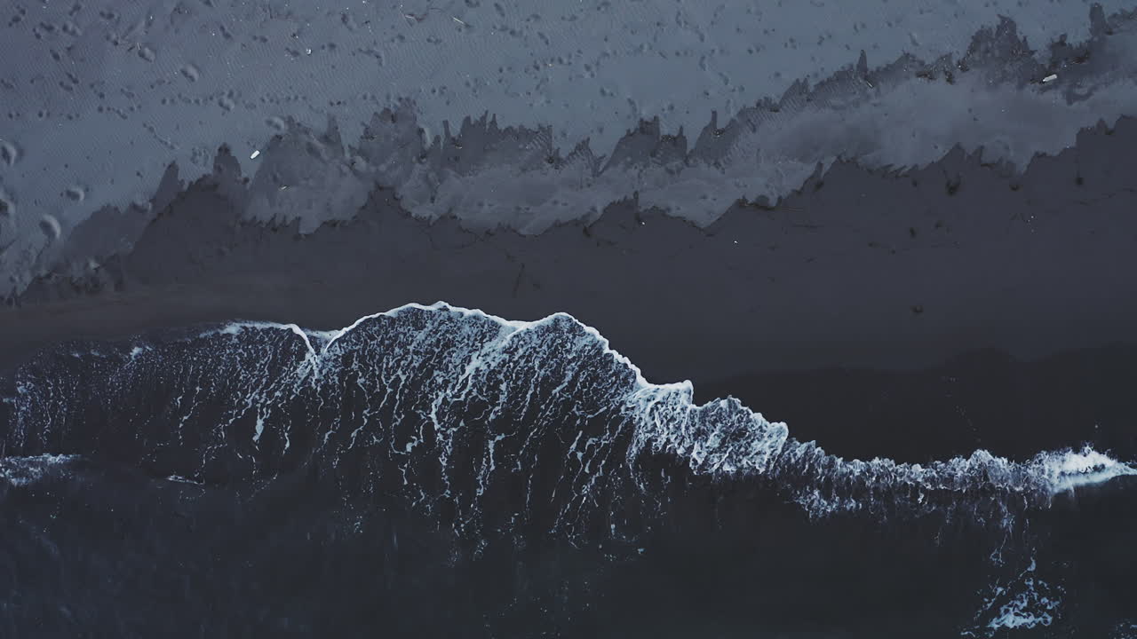 Dark Volcanic Beach with Waves