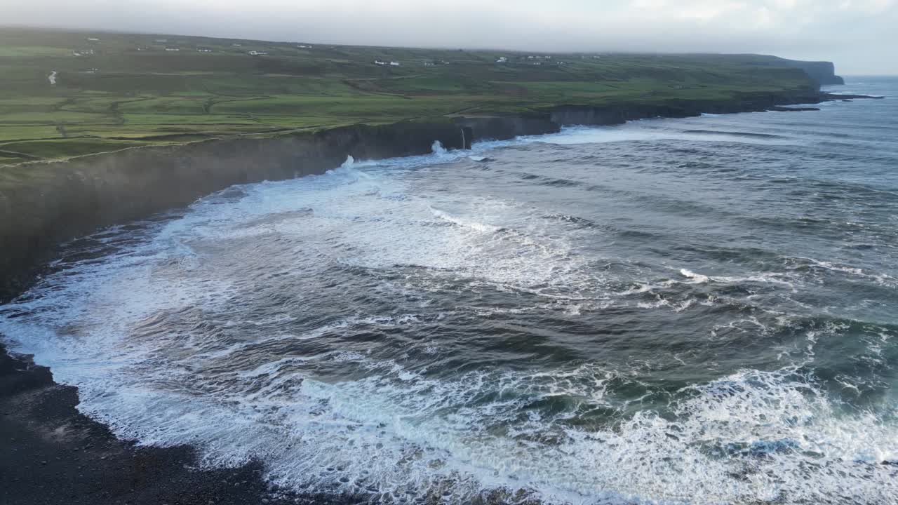 Rough sea waves breaking on beach of Doolin in Ireland