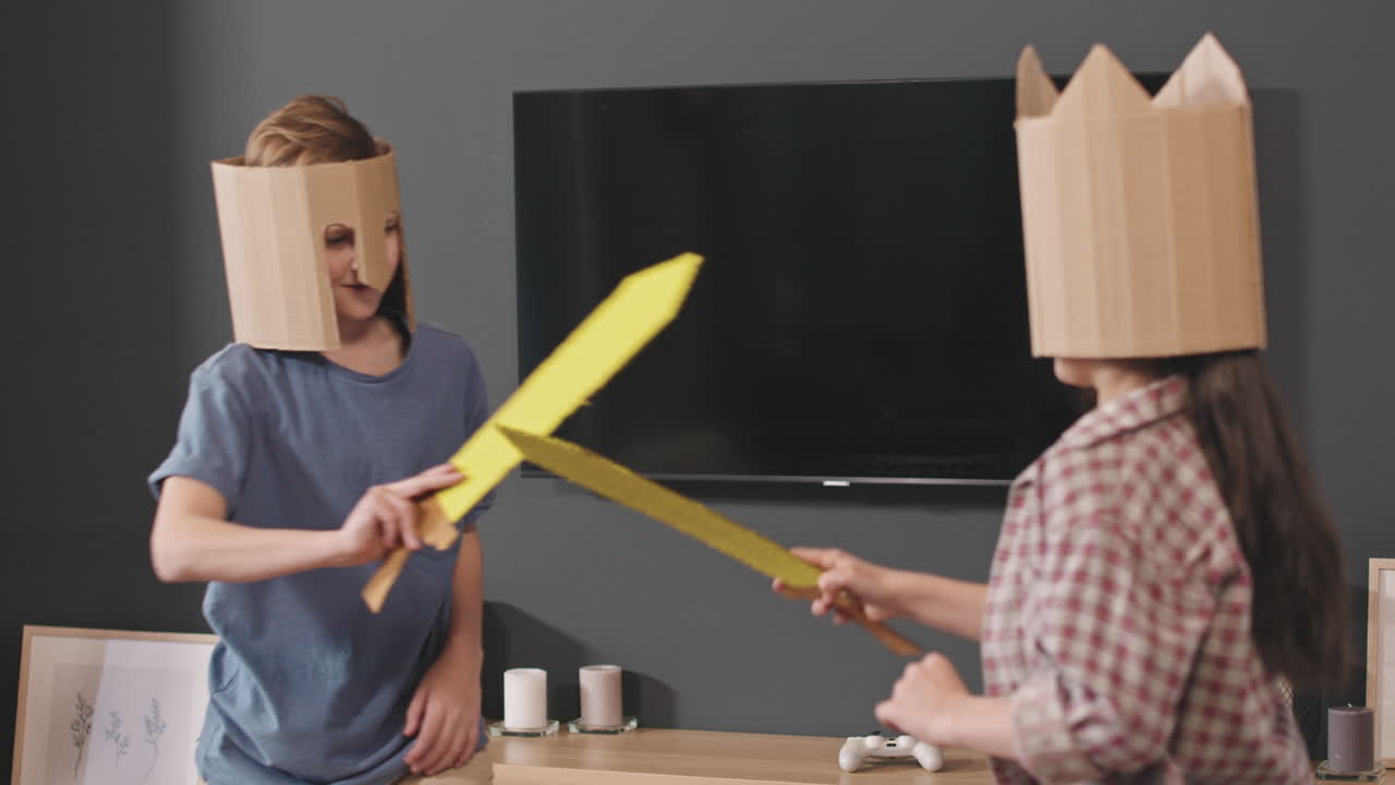 Siblings Fighting With Toy Swords For Fun