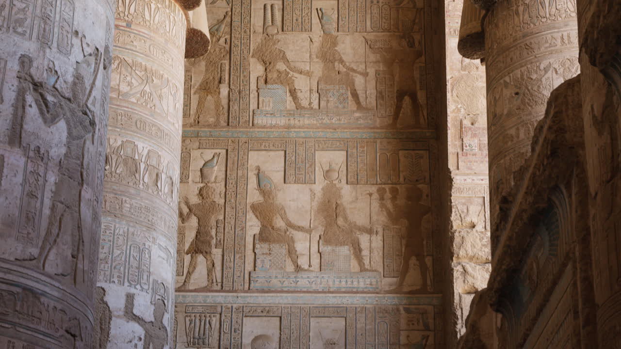 Ancient Egyptian wall carvings and hieroglyphs in Dendera temple, Egypt