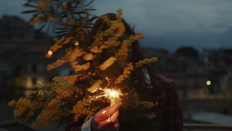 woman hold sparkles and flowers