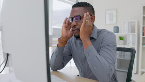 Stress,-headache-and-tired-black-man-on-computer