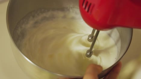 mixing cake cream with mixer