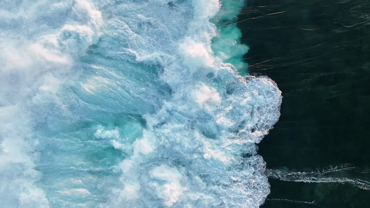 Breaking waves during sunset on a beach in the Canary Islands - Lanzarote