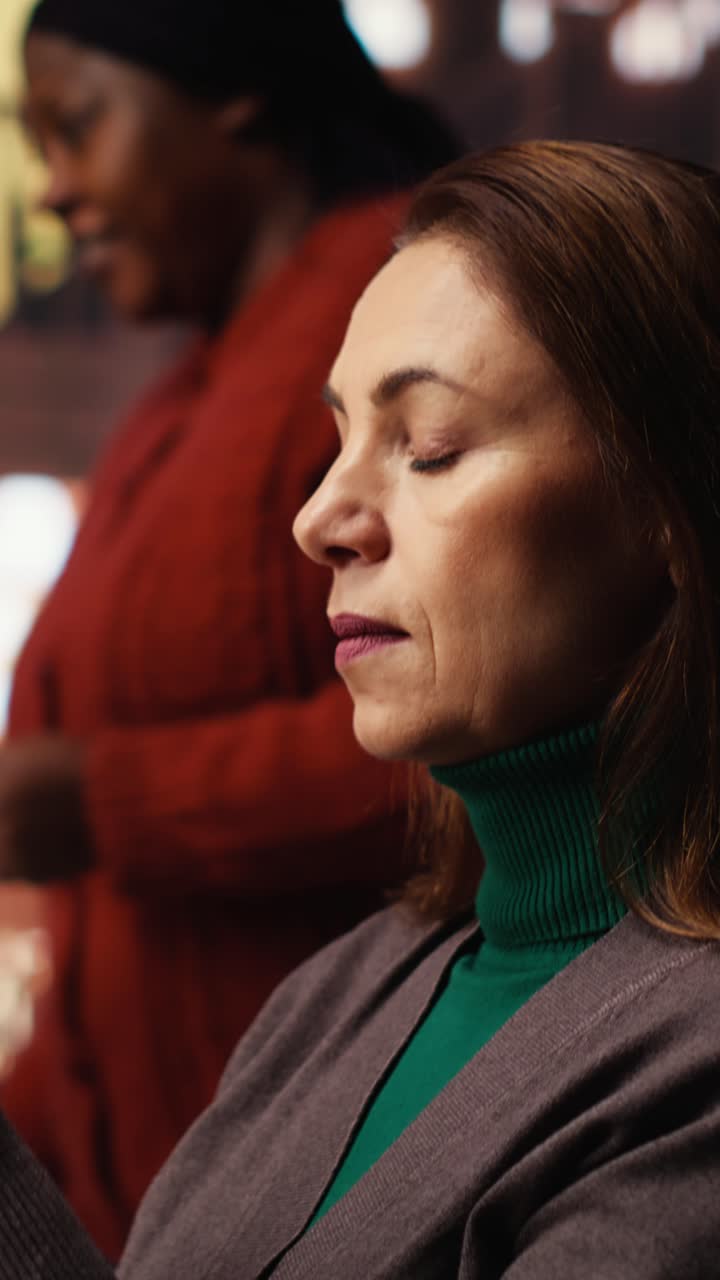 Vertical Video Mature student in a study room surrounded by books and paperwork
