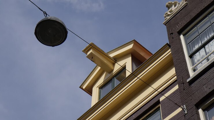 Hoisting Hooks Or Lifting Beams (Gevelhaken or Hijsbalken In Dutch) On Top of Building In Amsterdam - Low Angle Shot