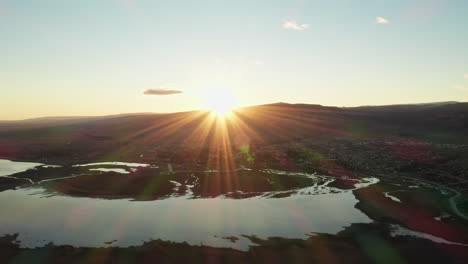 cinematic view of sunset over el calafate near santa cruz, patagonia, argentina.
aerial drone shot of beautiful sunset with epic sun rays.