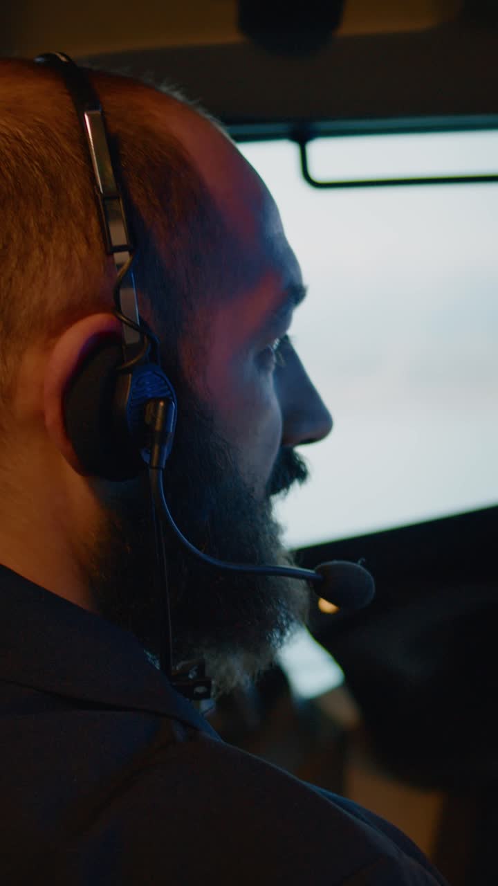 Pilot in cockpit wearing headset