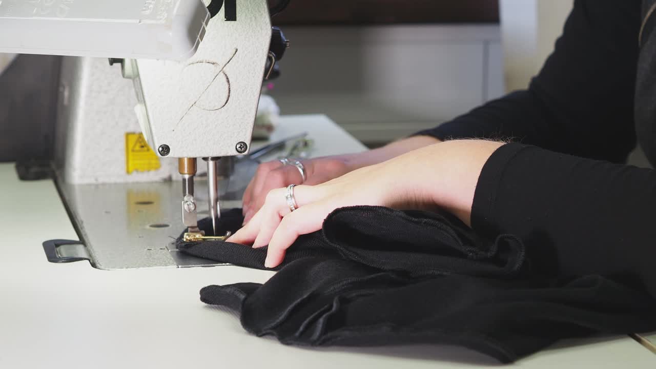Woman Sewing with Industrial Machine