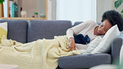 a sick woman with hot water bottle to help ease