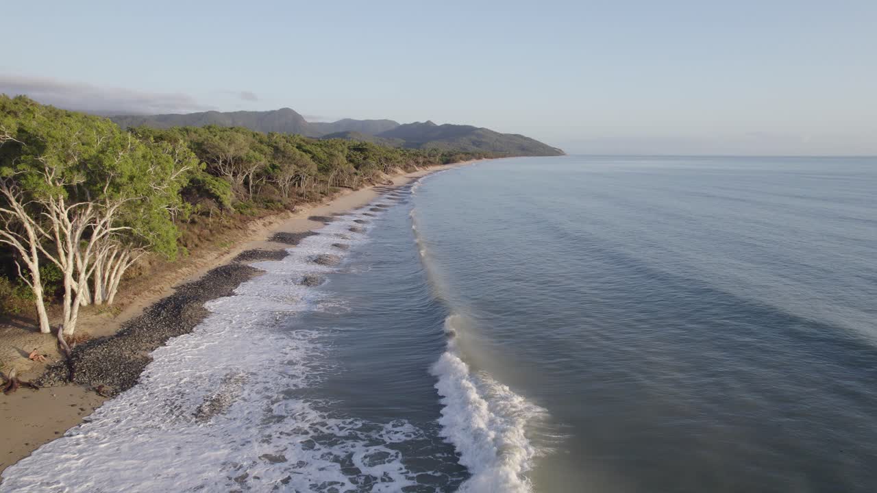 Wangetti Beach With Ocean Waves Crashing On The Shore In North Queensland, Australia - drone shot