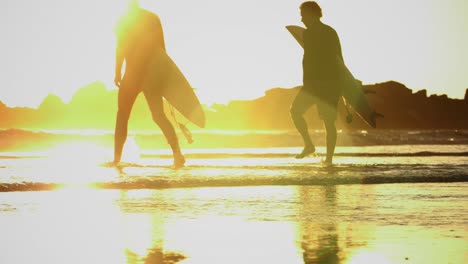 Surfers-Enter-The-Sea-On-Venice-Beach