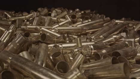 macro dolly of out of a large pile of spent bullet casings