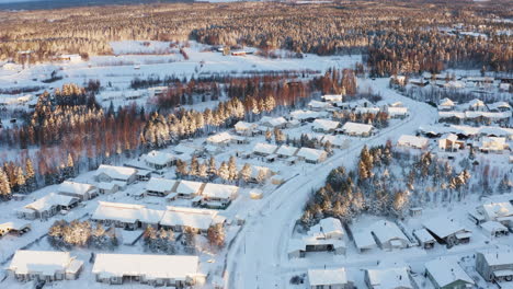 typical modern suburban residential housing neighbourhood in winter landscape, aerial bird's eye view