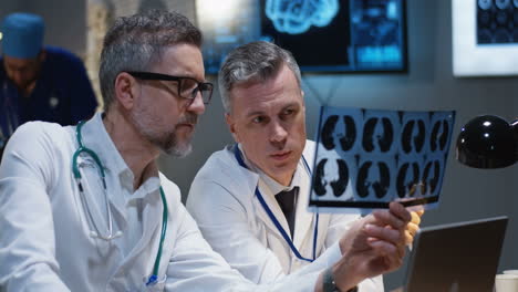 doctors reviewing x-ray images