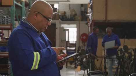 worker looking at a touch pad