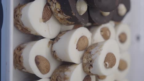 assorted gourmet white and dark chocolate nut treats