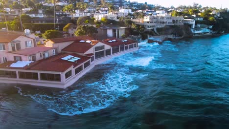 video shows waves crashing against homes