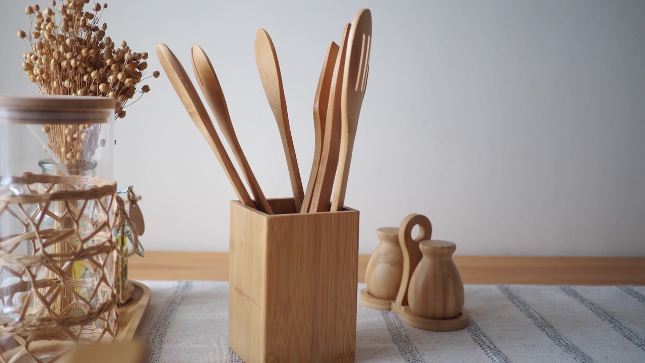Rustic Wooden Kitchen Utensils and Decor on a Table